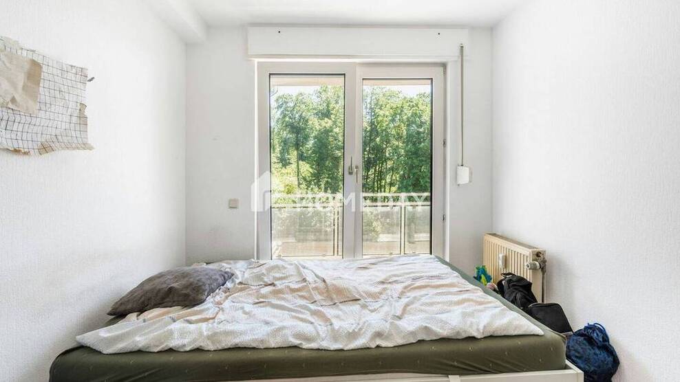 Großzügige 3-Zimmer-Wohnung mit 2 Balkonen und Tiefgaragenstellplatz - stilvoll wohnen am Waldrand