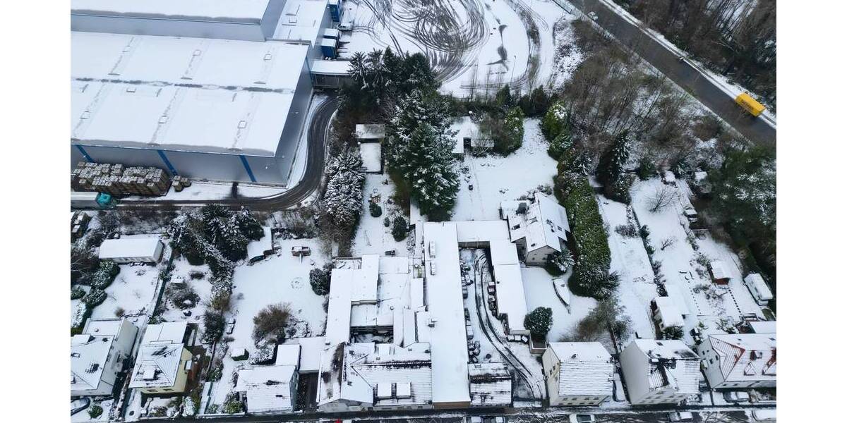 Baugrundstück mit mehreren Wohn- und Gewerbebestandsgebäuden zimmer