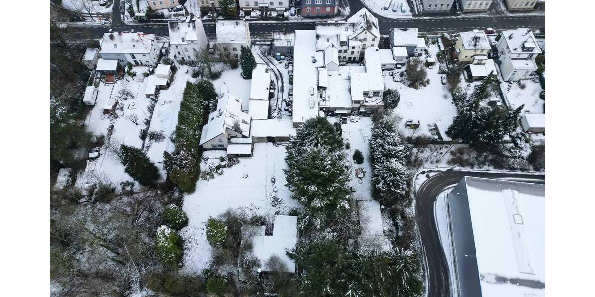 Baugrundstück mit mehreren Wohn- und Gewerbebestandsgebäuden zimmer